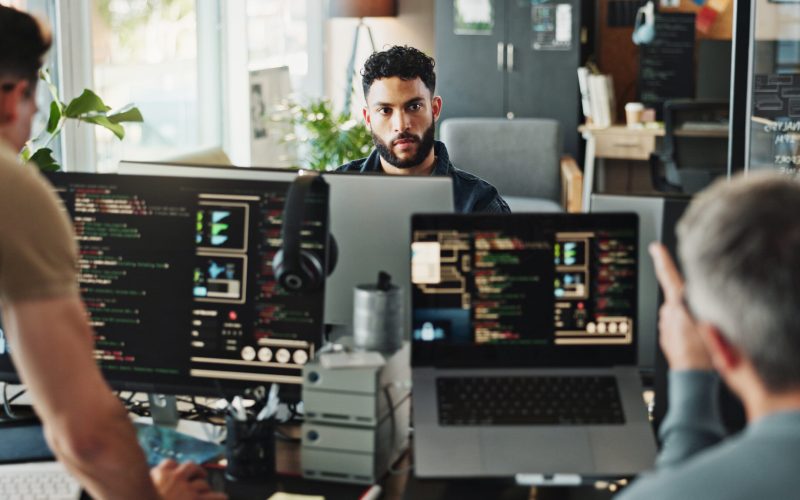 Man, developer and programmer with computer for coding solutions, problem solving or ideas at offic.